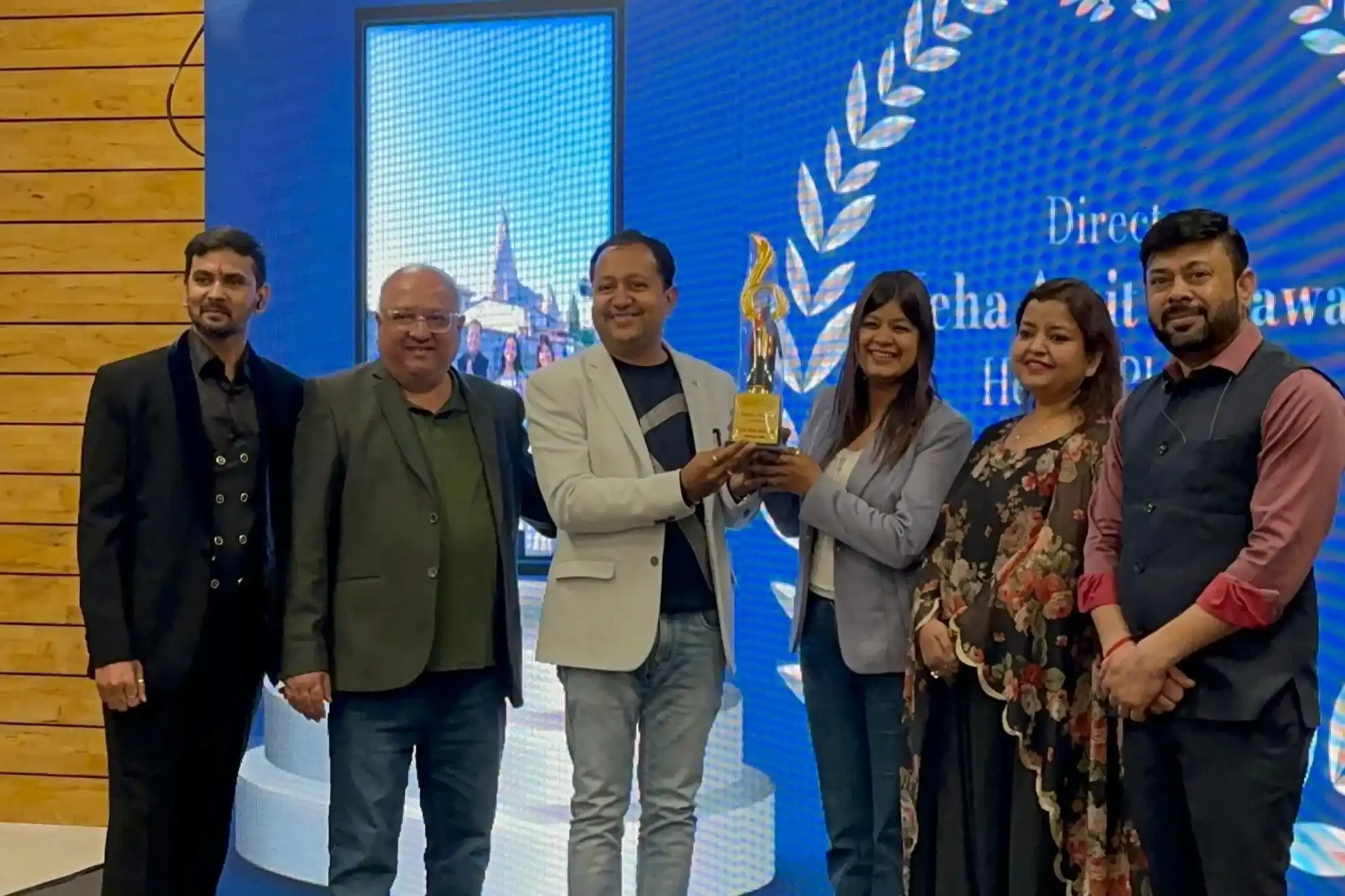 Happy Indian family protected by comprehensive health and life insurance coverage from Sampurn Insurance