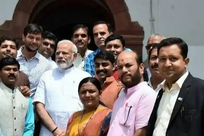 Happy Indian family protected by comprehensive health and life insurance coverage from Sampurn Insurance